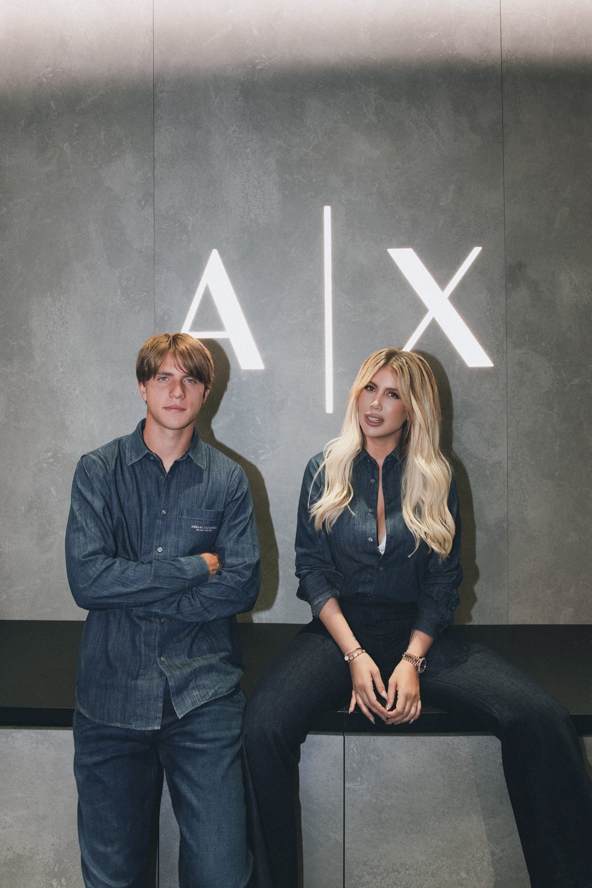 Wanda Nara and Valentino in matching Armani Exchange denim under the A|X logo